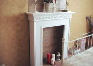 White imitation fireplace in the bedroom