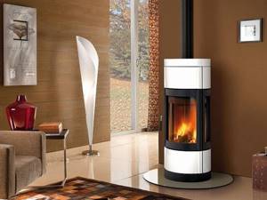 white fireplace with convex glass