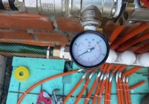 Why do you need a pressure gauge in a heating system?