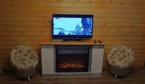 Do-it-yourself electric fireplace: reasonable savings and originality