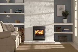 There are two options to achieve this effect - paint the existing brick fireplace or veneer it with clinker tiles