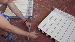Photo - assembly of bimetallic sections into a radiator