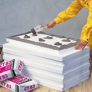 Adhesive for extruded polystyrene foam to concrete