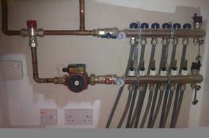Manifold for controlling water heated floors