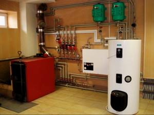 Boiler room with buffer tank and solid fuel heating