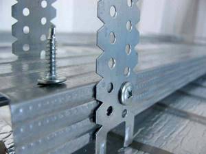 fastening the profile to hangers with self-tapping screws