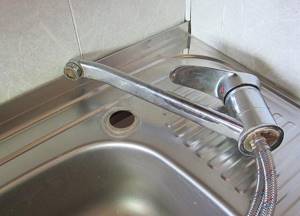 installing a faucet in the kitchen