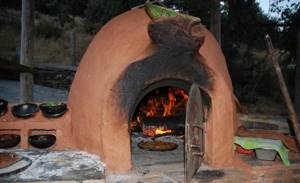 The photo shows a clay oven