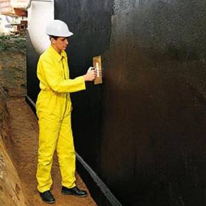 Applying mastic to the foundation