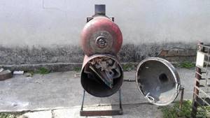 Rocket stove with a cylinder for combustion of exhaust gases