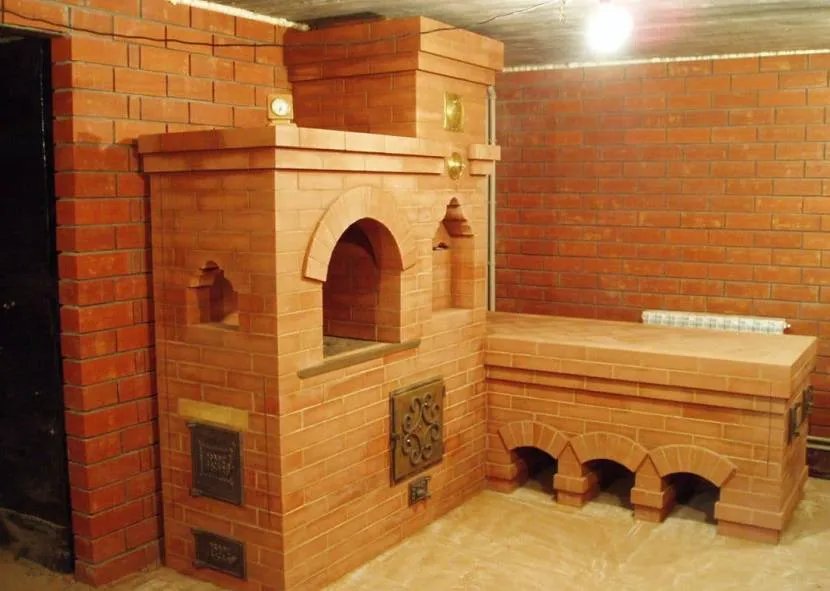Brick stove with heated bench
