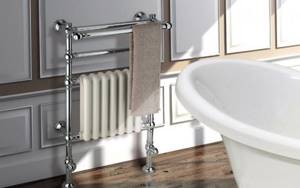 Heated towel rail with radiator in a classic style bathroom