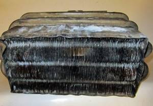 Geyser heat exchanger with carbon deposits