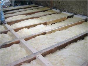 Laying mineral wool along joists