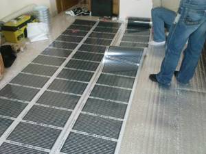 Installation of thermal film for infrared heated floors