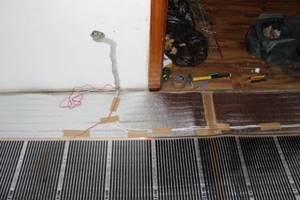Installation of a thermostat for film heated floors