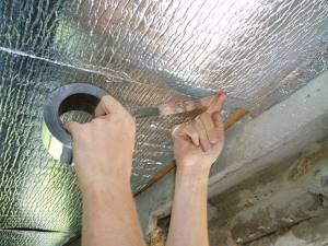 Insulating the ceiling in a house from the inside with foil penofol