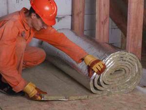 Insulation of walls using rolled foil material
