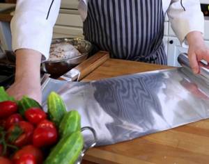 Which side of the foil should you wrap fish and meat when baking?