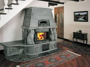 Closed stove fireplace under the stairs