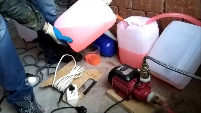 Pouring antifreeze into the heating system