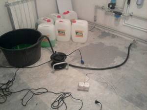 Filling the system with antifreeze using a submersible vibration pump.